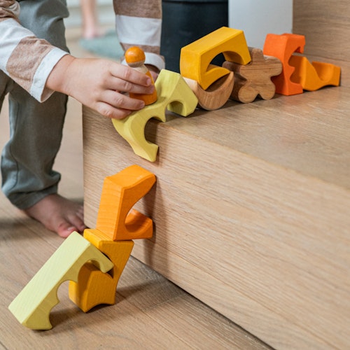 Bauspiel gelb 12 Teile im Rahmen 18,6 x 18,6 cm