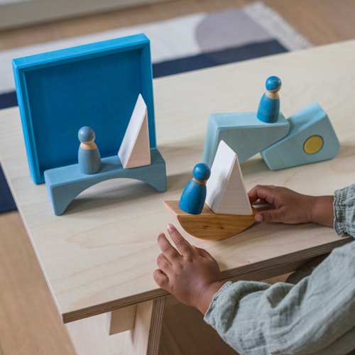 Bauspiel blau 7 Teile im Rahmen 18,6 x 18,6 cm