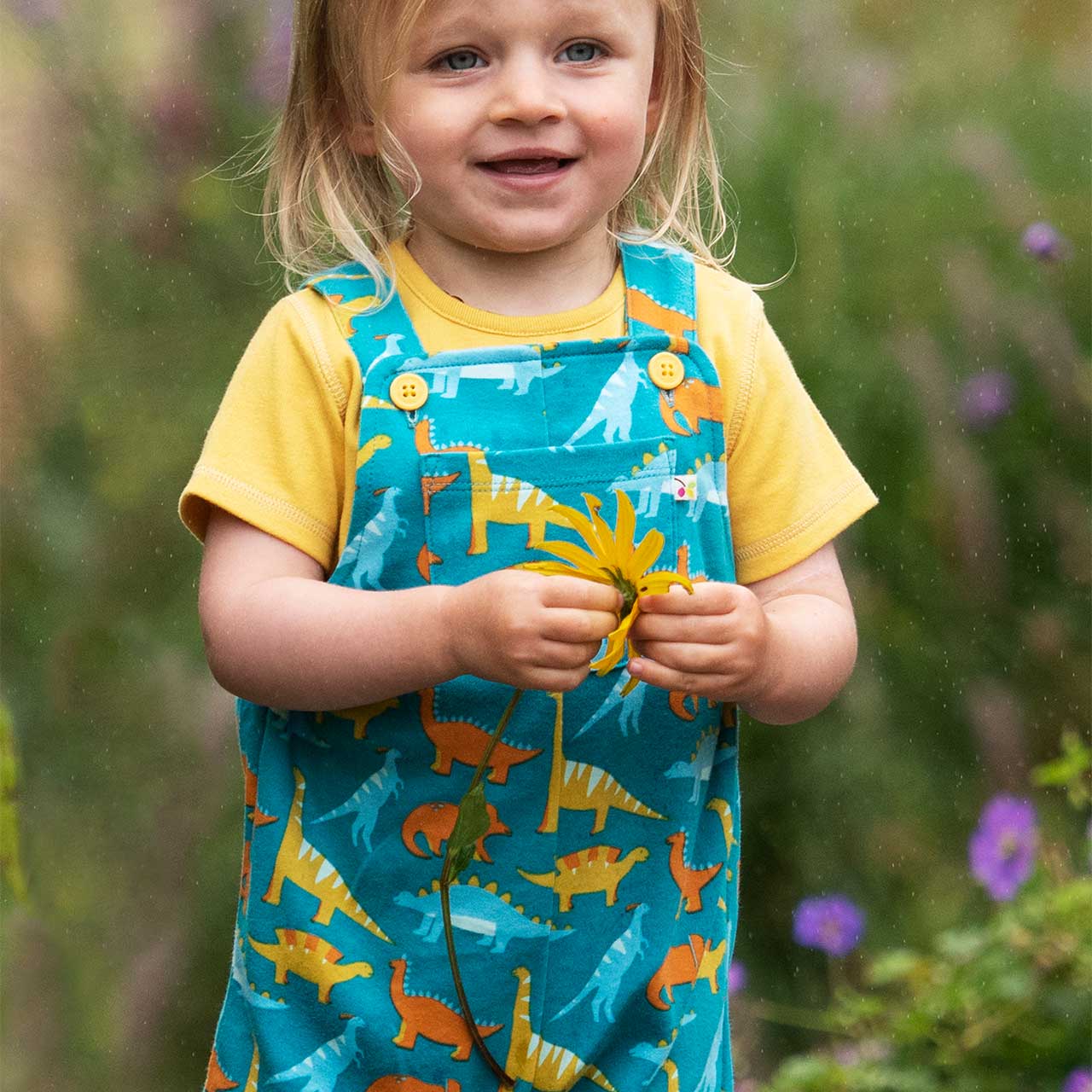 Mitwachsender Strampler ohne Arm Dinos