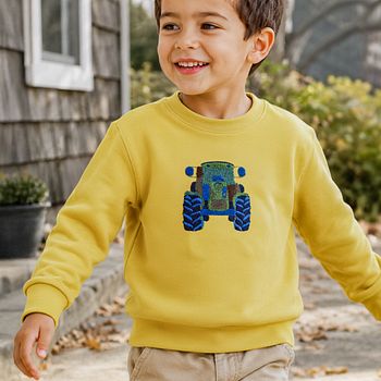Pullover Traktor Stickerei gelb