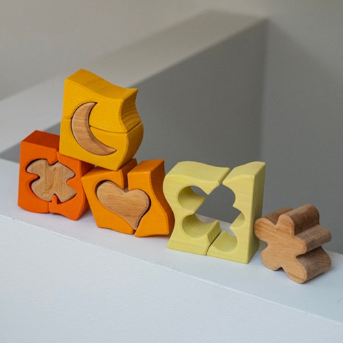 Bauspiel gelb 12 Teile im Rahmen 18,6 x 18,6 cm